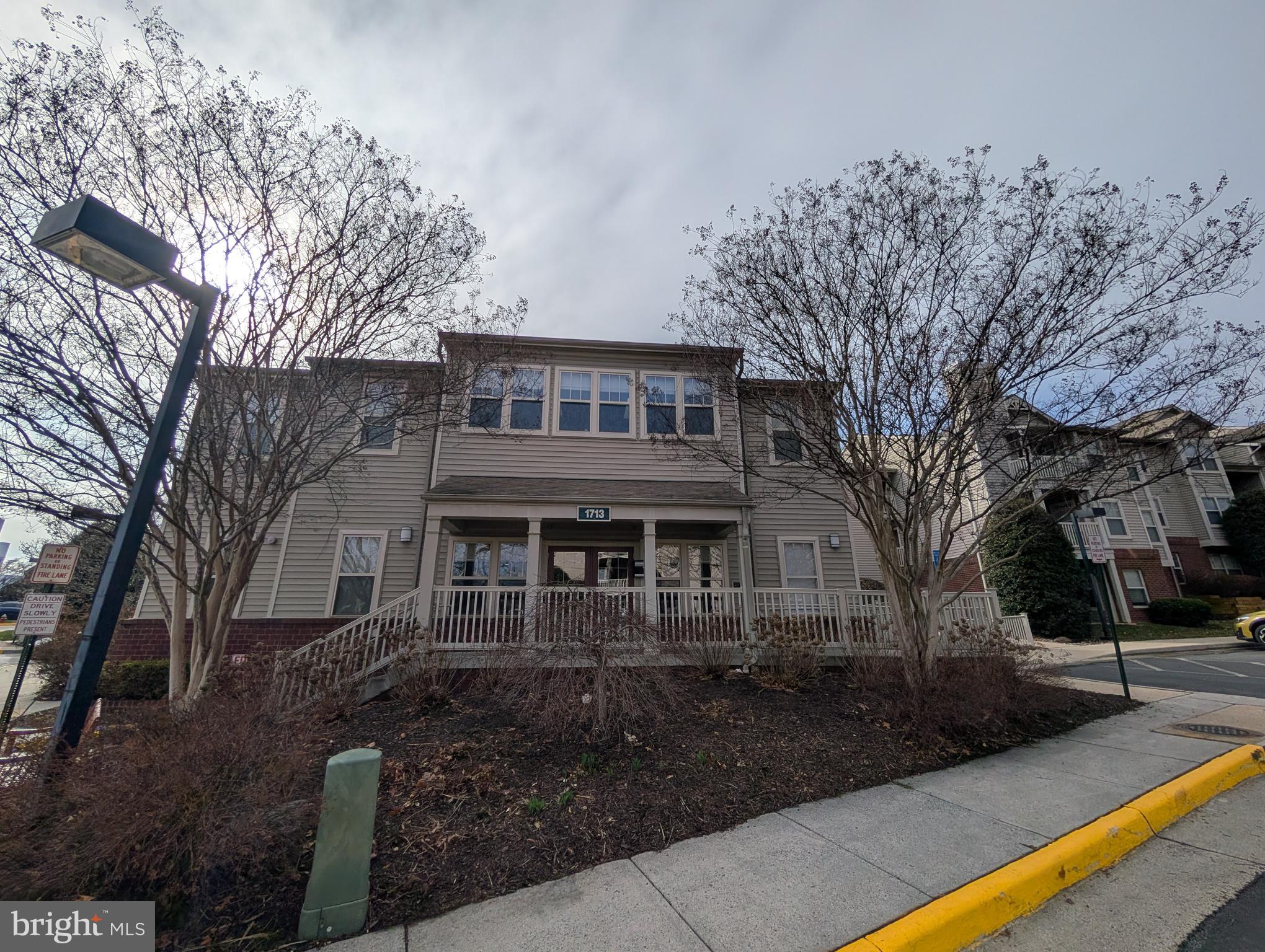 1708 Abercromby Court, Unit 1708B Reston, VA 20190 - Photo 26 of 26 a front view of a house with yard and green space