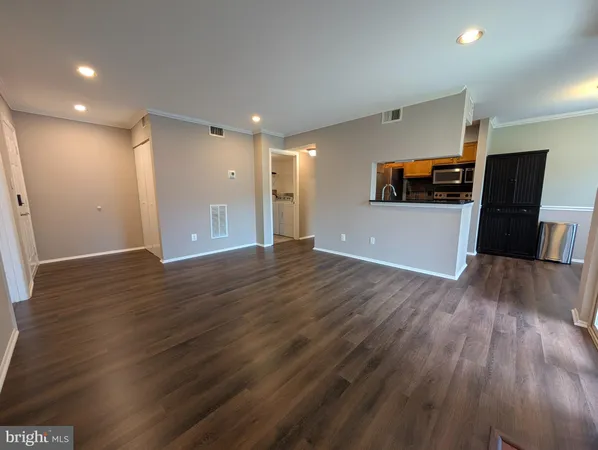 a view of a livingroom with wooden floor