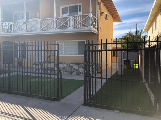 a view of a brick house with a large window