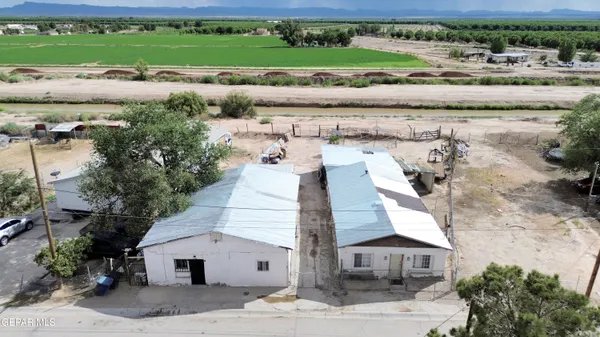 a view of a house with a yard and garage