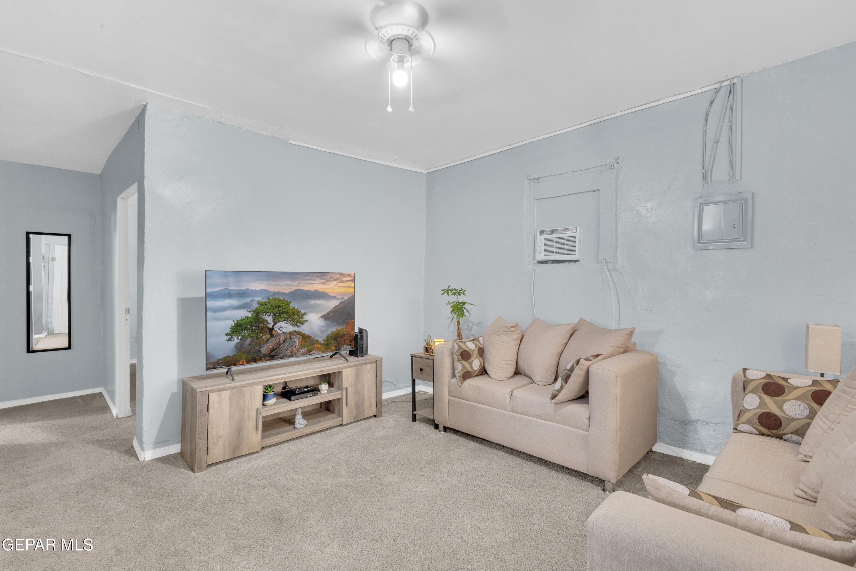 720 Johnson Street Fabens, TX 79838 - Photo 12 of 68 a living room with furniture and a flat screen tv