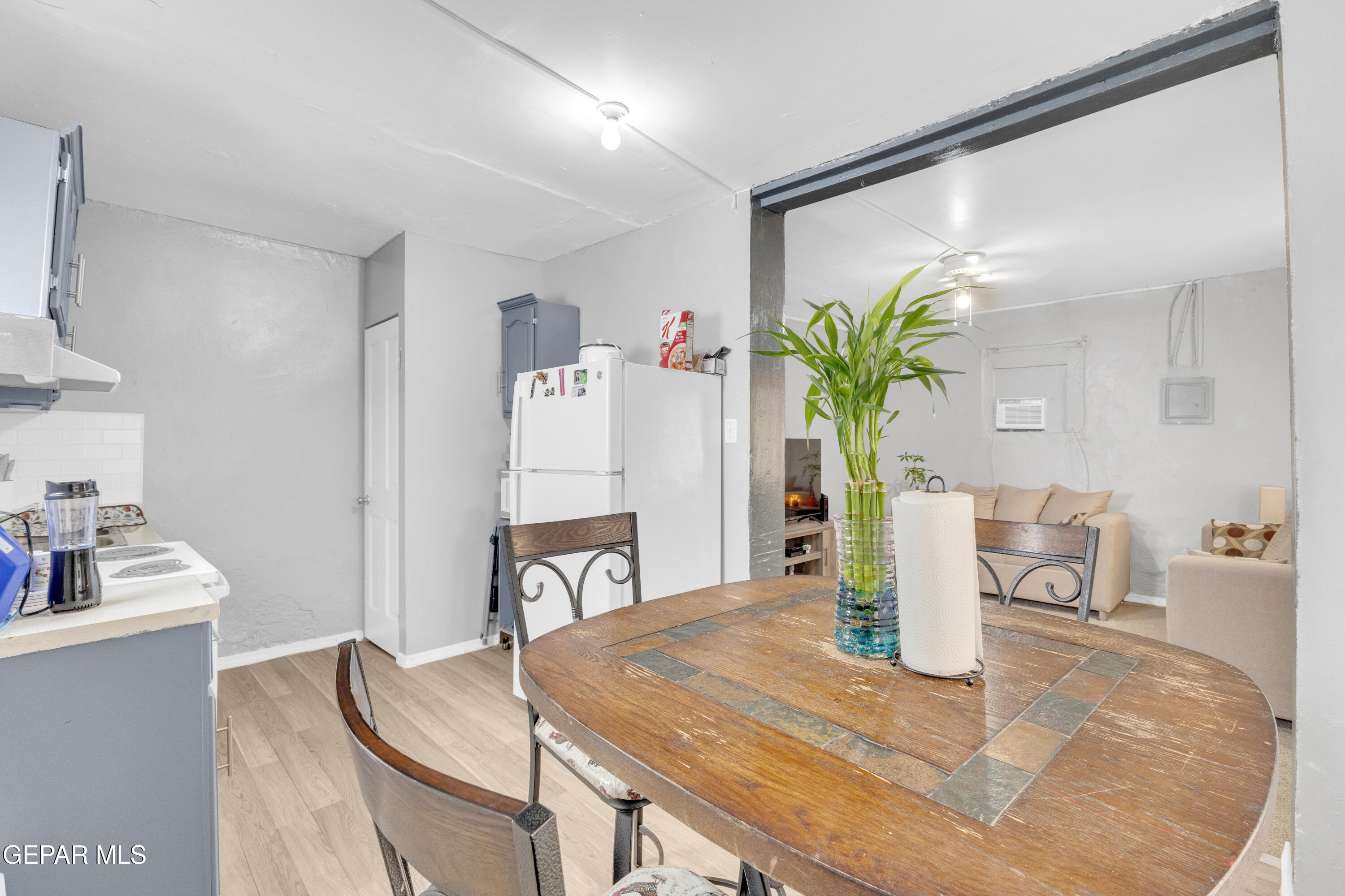 720 Johnson Street Fabens, TX 79838 - Photo 14 of 68 a view of a dining room with furniture and wooden floor