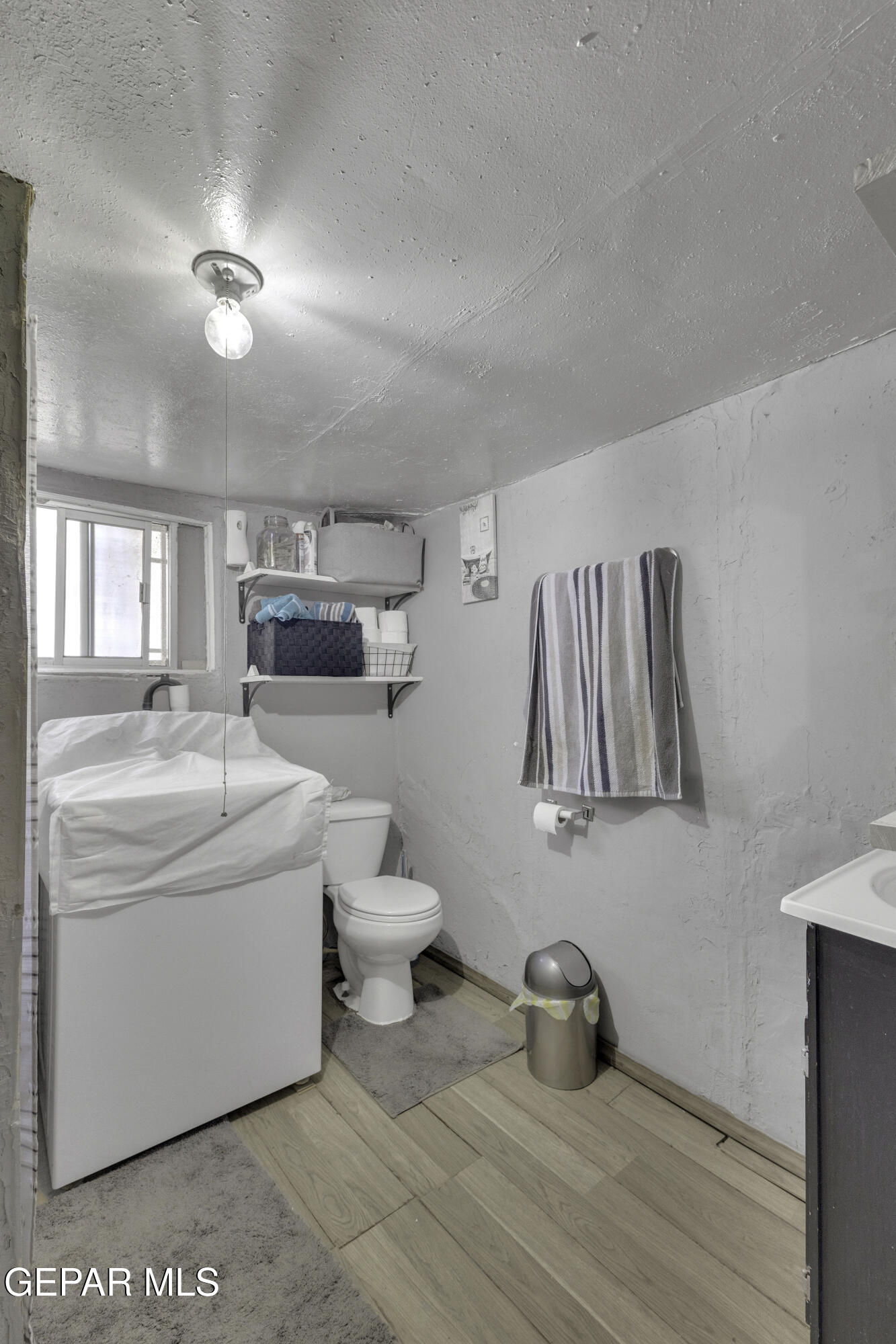 720 Johnson Street Fabens, TX 79838 - Photo 29 of 68 a bathroom with a sink a toilet and a mirror