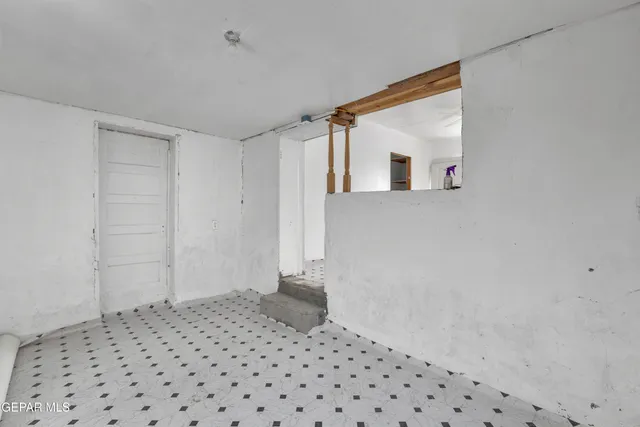 a living room with furniture and a ceiling fan
