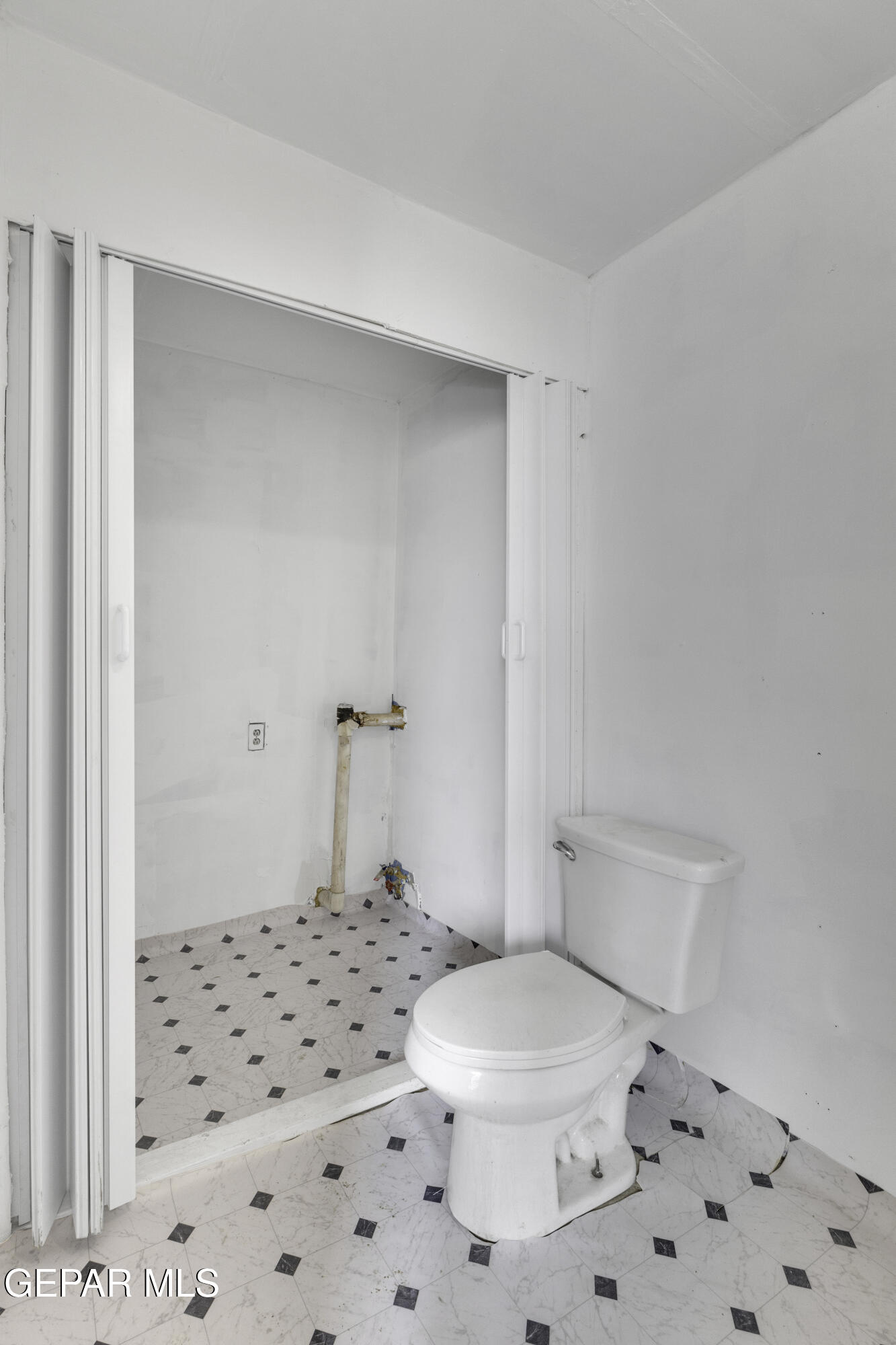 720 Johnson Street Fabens, TX 79838 - Photo 39 of 68 a white toilet sitting next to a bathroom sink