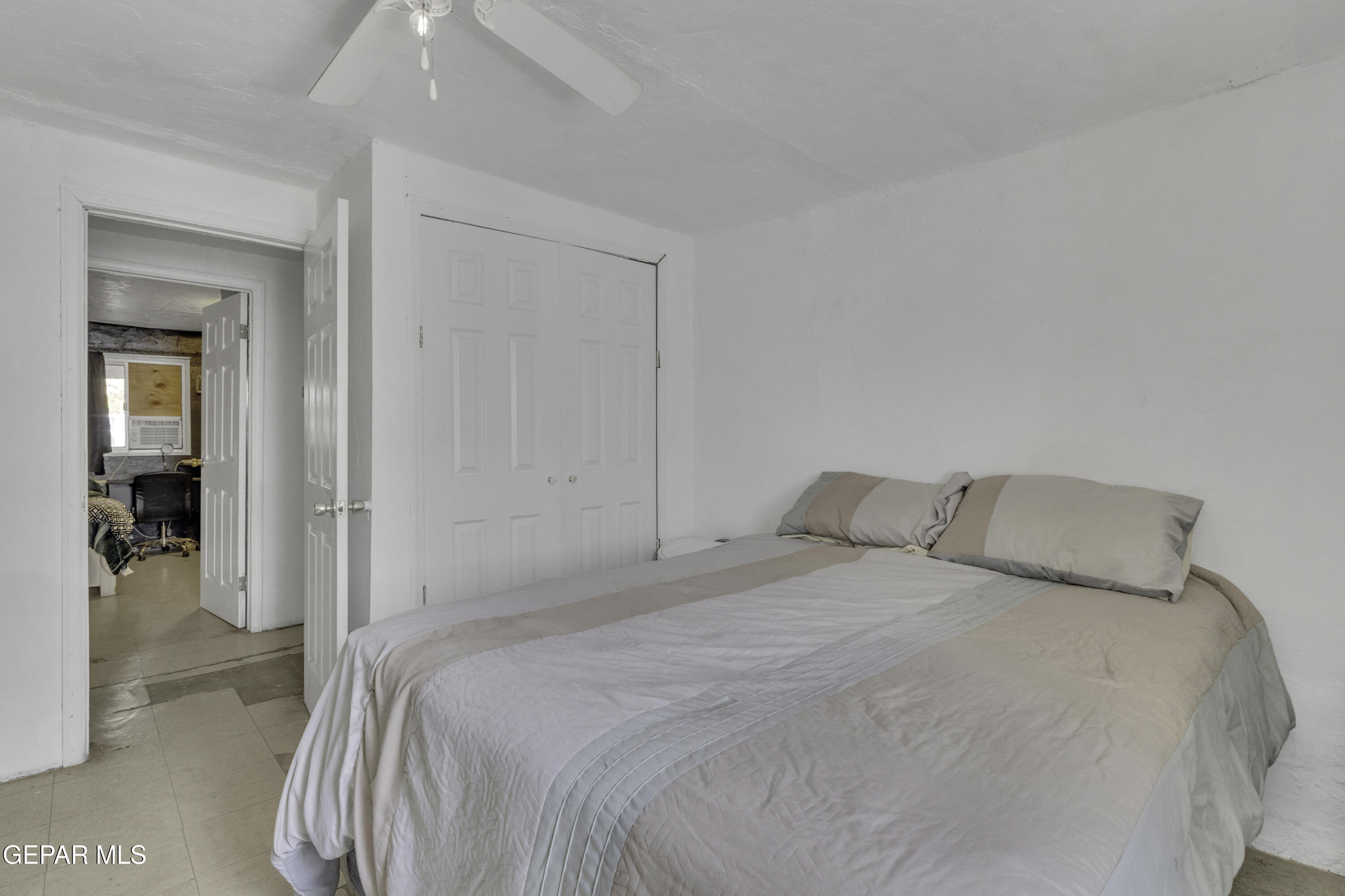 720 Johnson Street Fabens, TX 79838 - Photo 47 of 68 a bedroom with a bed and a bathroom