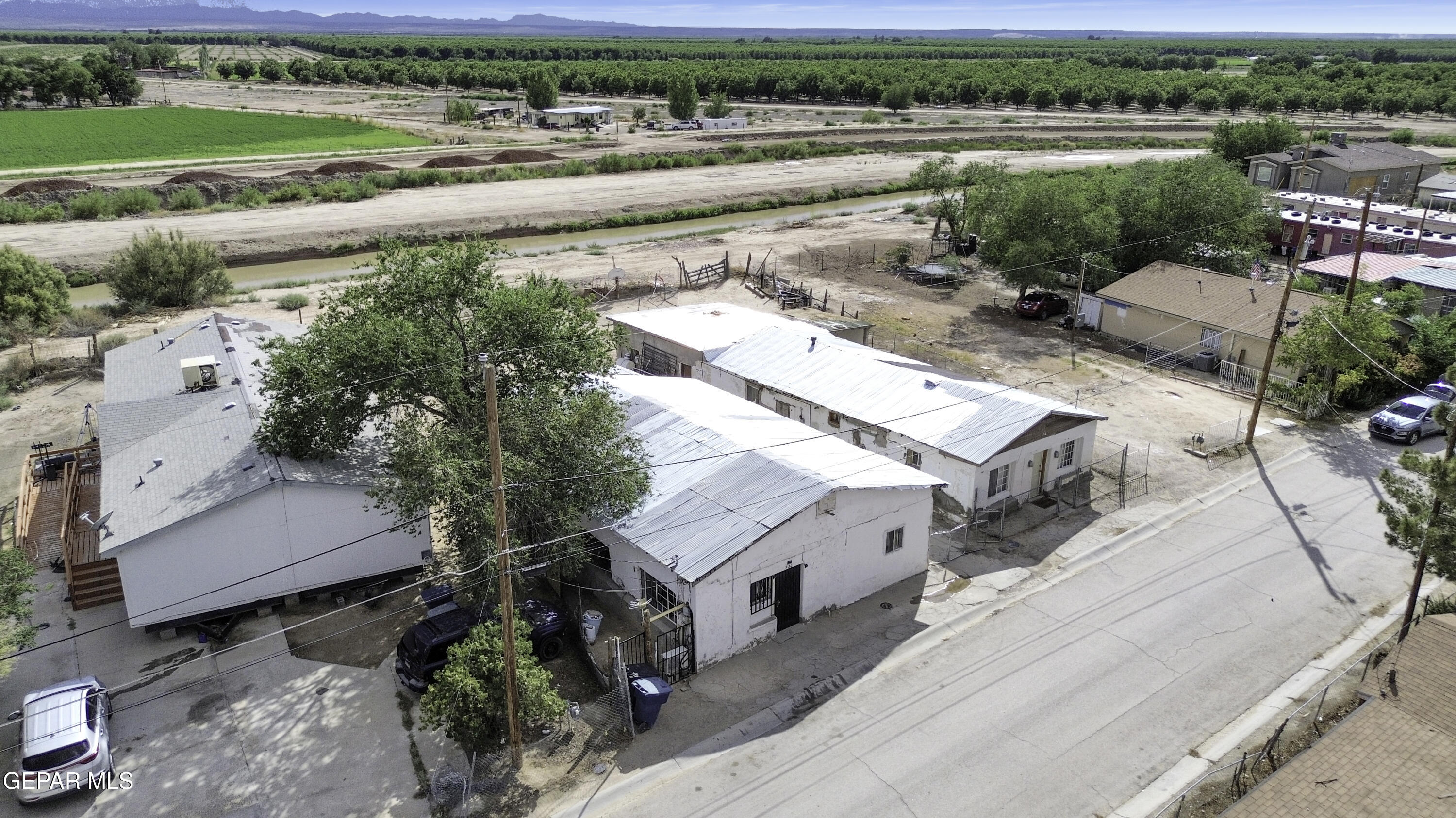 720 Johnson Street Fabens, TX 79838 - Photo 54 of 68 an aerial view of a house with a garden and lake view