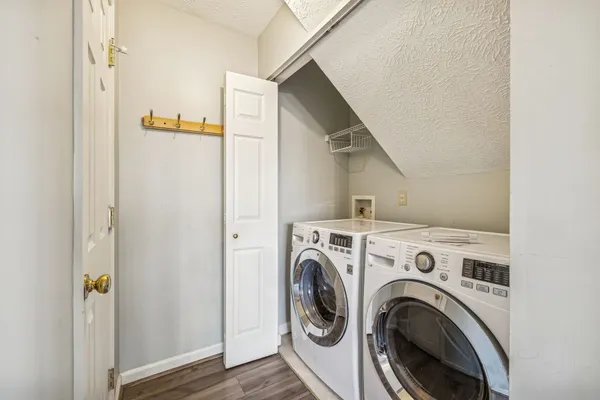 a view of storage and utility room with washer and dryer