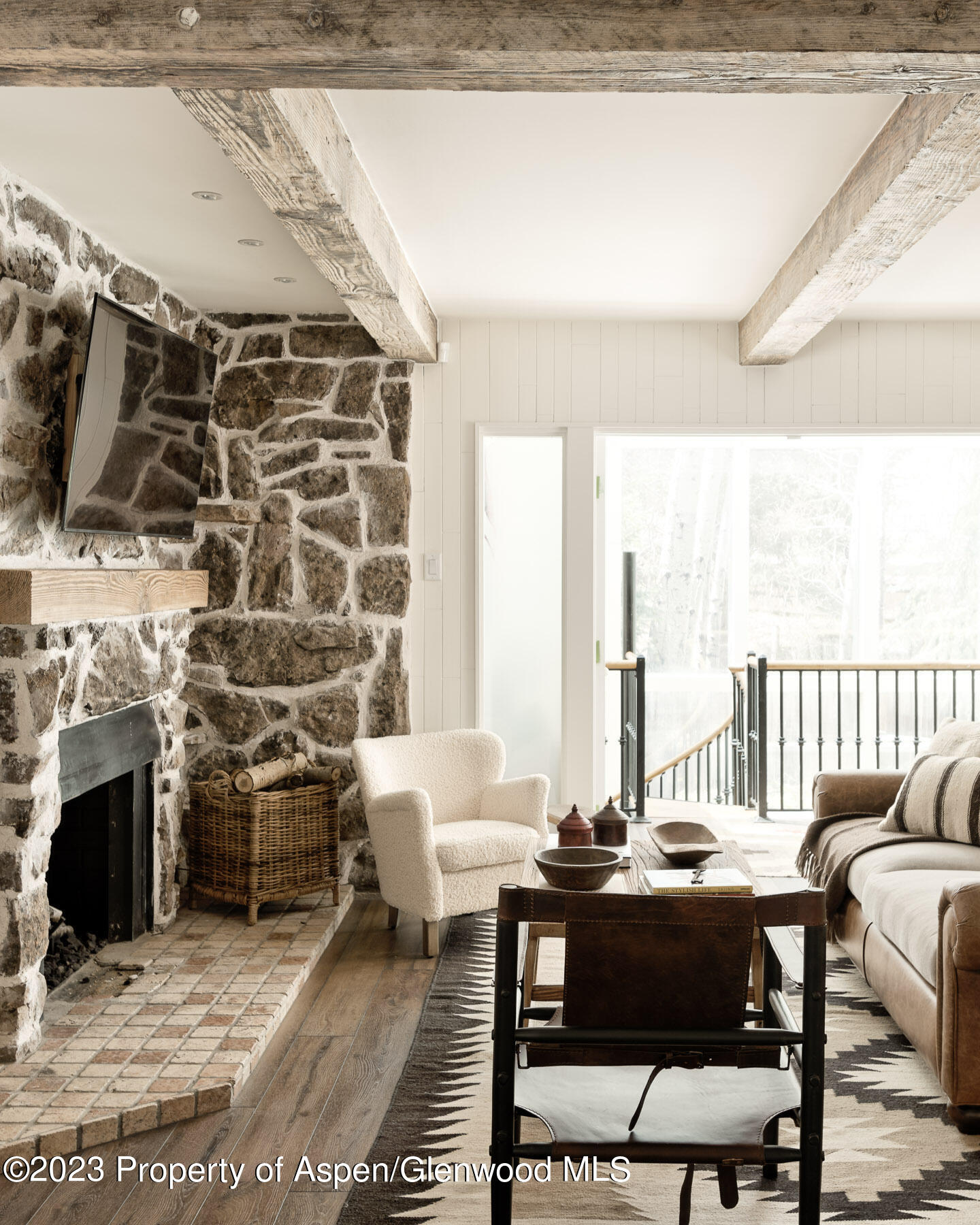 1470 Snowmass Creek Road Snowmass, CO 81654 - Photo 12 of 63 a living room with furniture and a fireplace