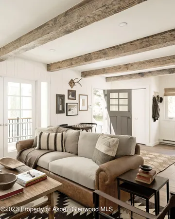 a living room with furniture and a rug