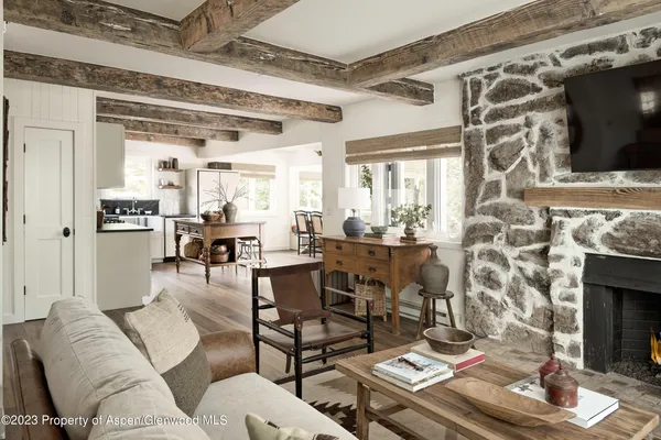 a kitchen with a refrigerator a stove and a sink