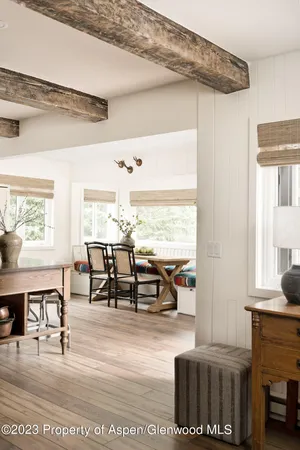 a view of a dining room with furniture window and wooden floor