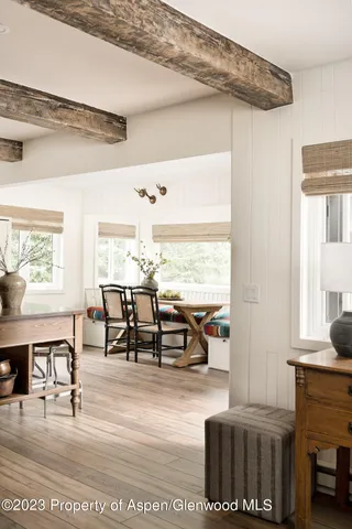 a view of a dining room with furniture window and wooden floor
