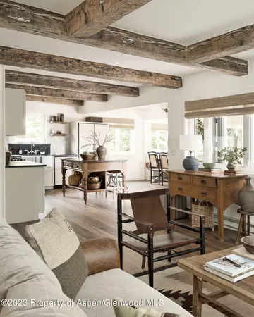 a bedroom with a bed and a flat tv screen on dresser