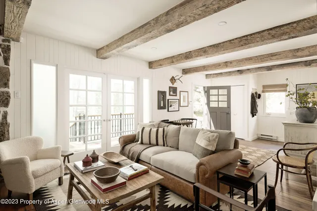 a room with fireplace and cabinets