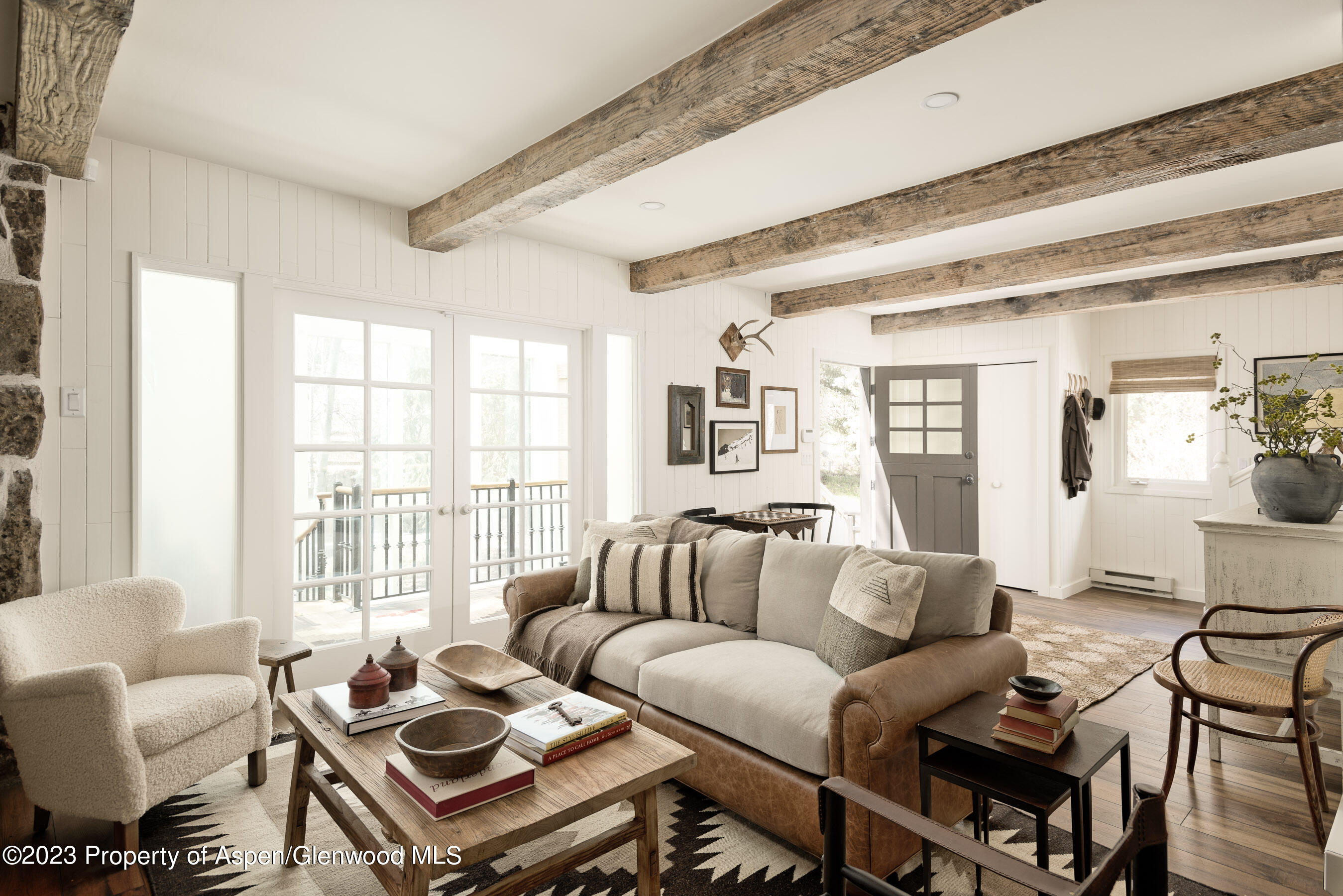 1470 Snowmass Creek Road Snowmass, CO 81654 - Photo 4 of 63 a living room with furniture and a large window