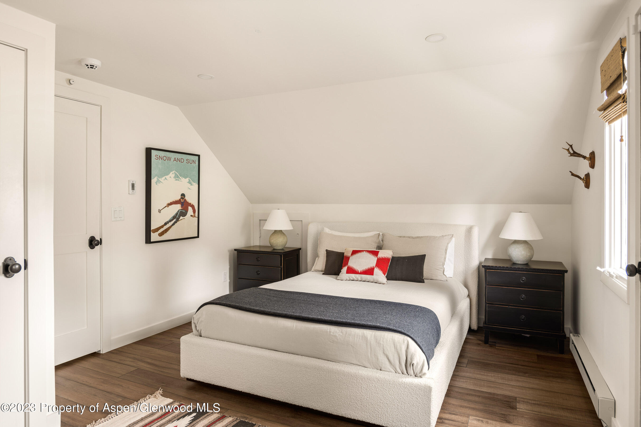 1470 Snowmass Creek Road Snowmass, CO 81654 - Photo 51 of 63 a bedroom with a bed and a window