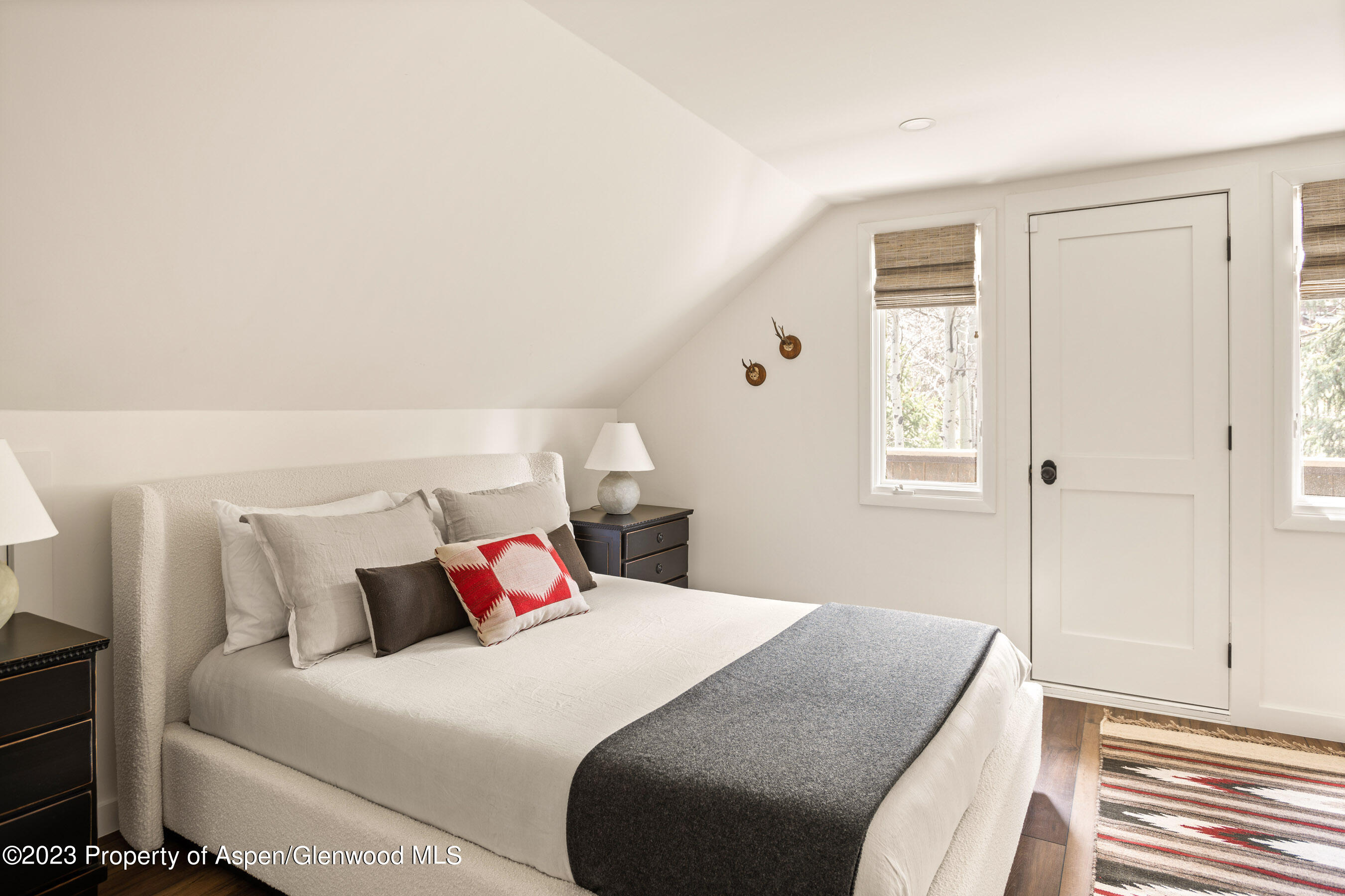 1470 Snowmass Creek Road Snowmass, CO 81654 - Photo 52 of 63 a bedroom with a bed and a window