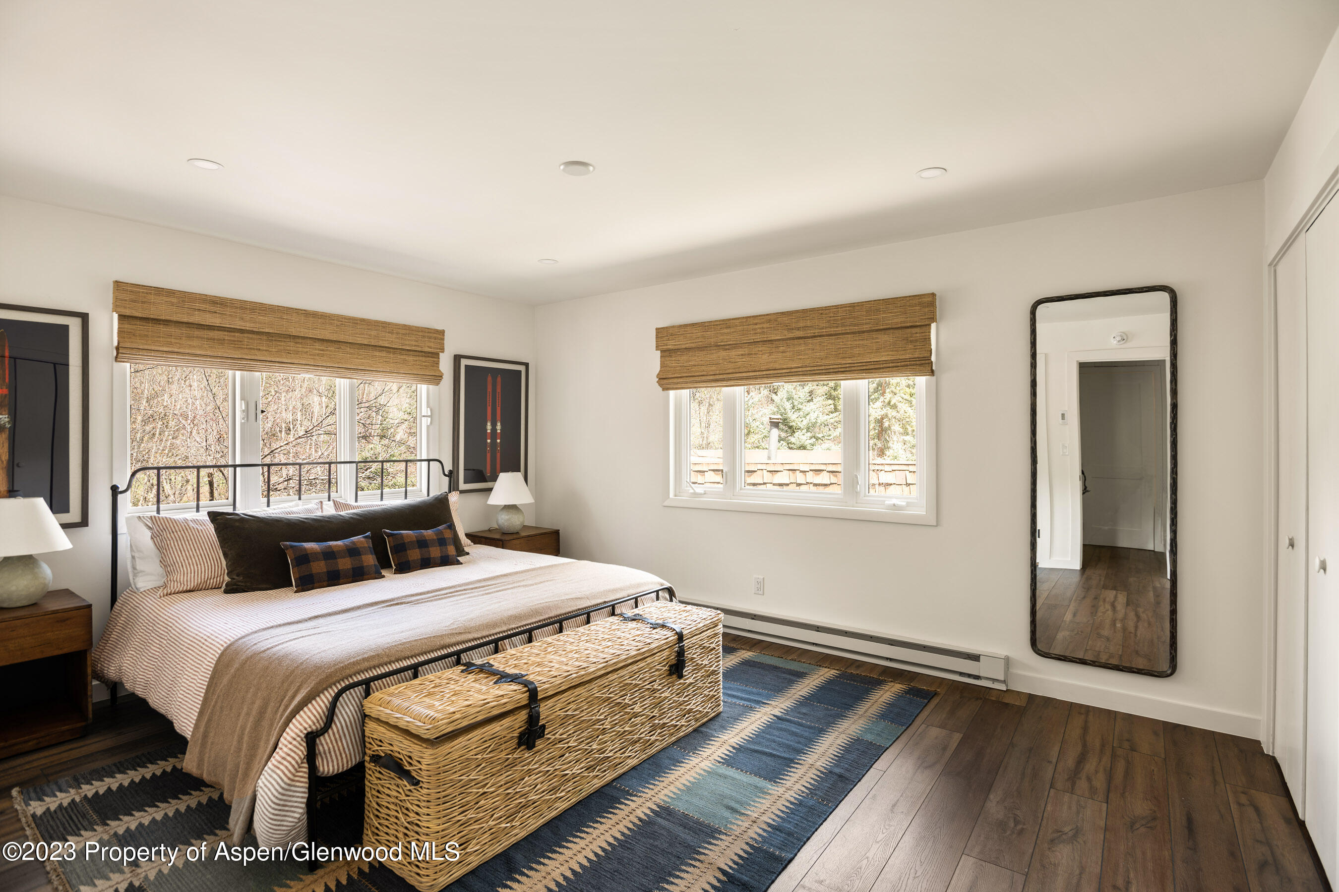 1470 Snowmass Creek Road Snowmass, CO 81654 - Photo 58 of 63 a bedroom with a large bed and a large window