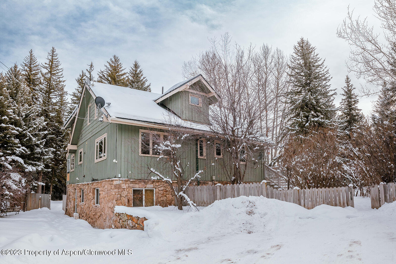 1470 Snowmass Creek Road Snowmass, CO 81654 - Photo 59 of 63 a view of a house with a snow in the yard