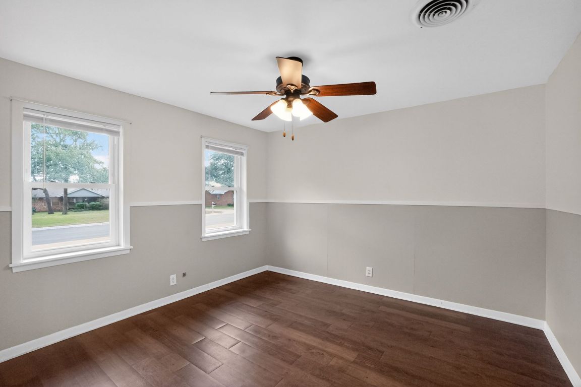 105 Shannon Lane Georgetown, TX 78628 - Photo 4 of 15 a view of a room with wooden floor closet and windows