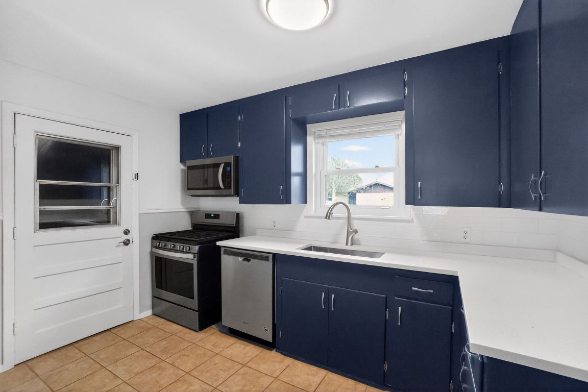 105 Shannon Lane Georgetown, TX 78628 - Photo 8 of 15 a kitchen with a sink and cabinets