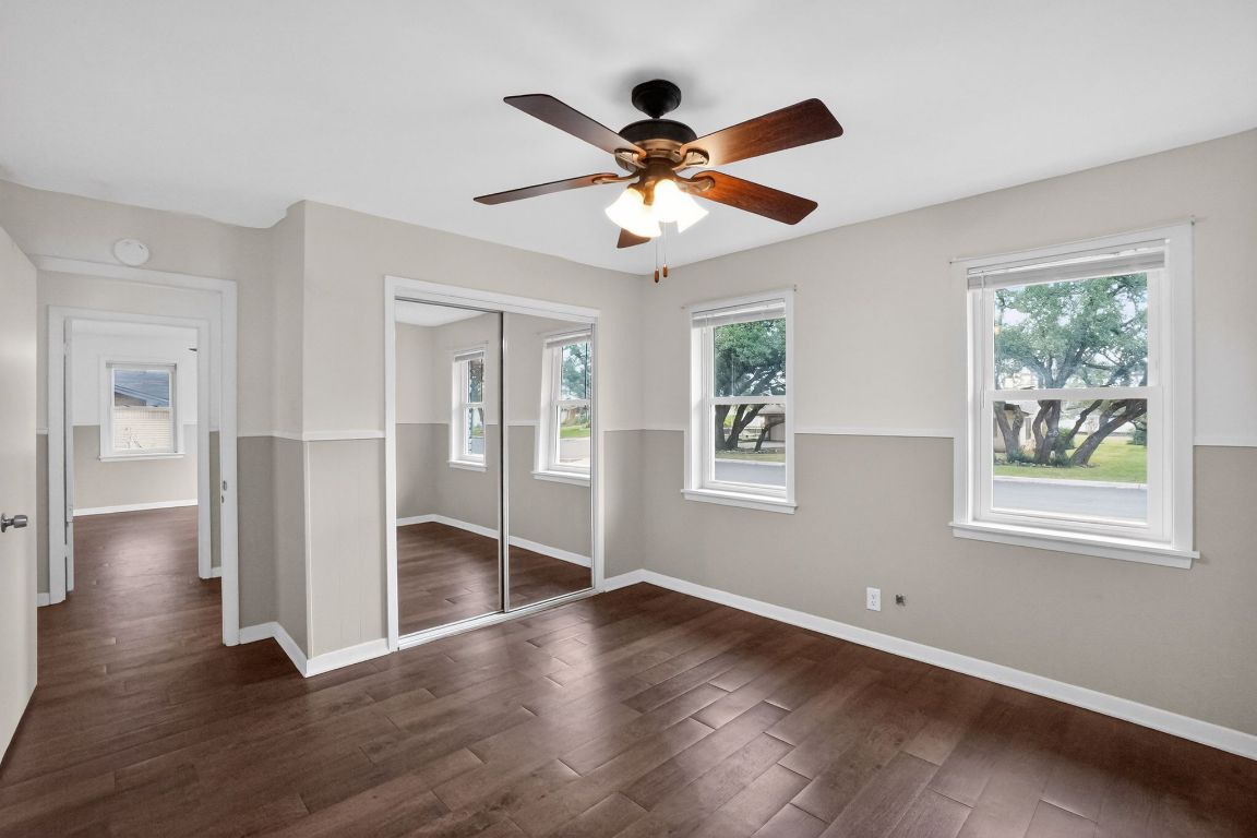 105 Shannon Lane Georgetown, TX 78628 - Photo 10 of 15 a view of an empty room with wooden floor and a window