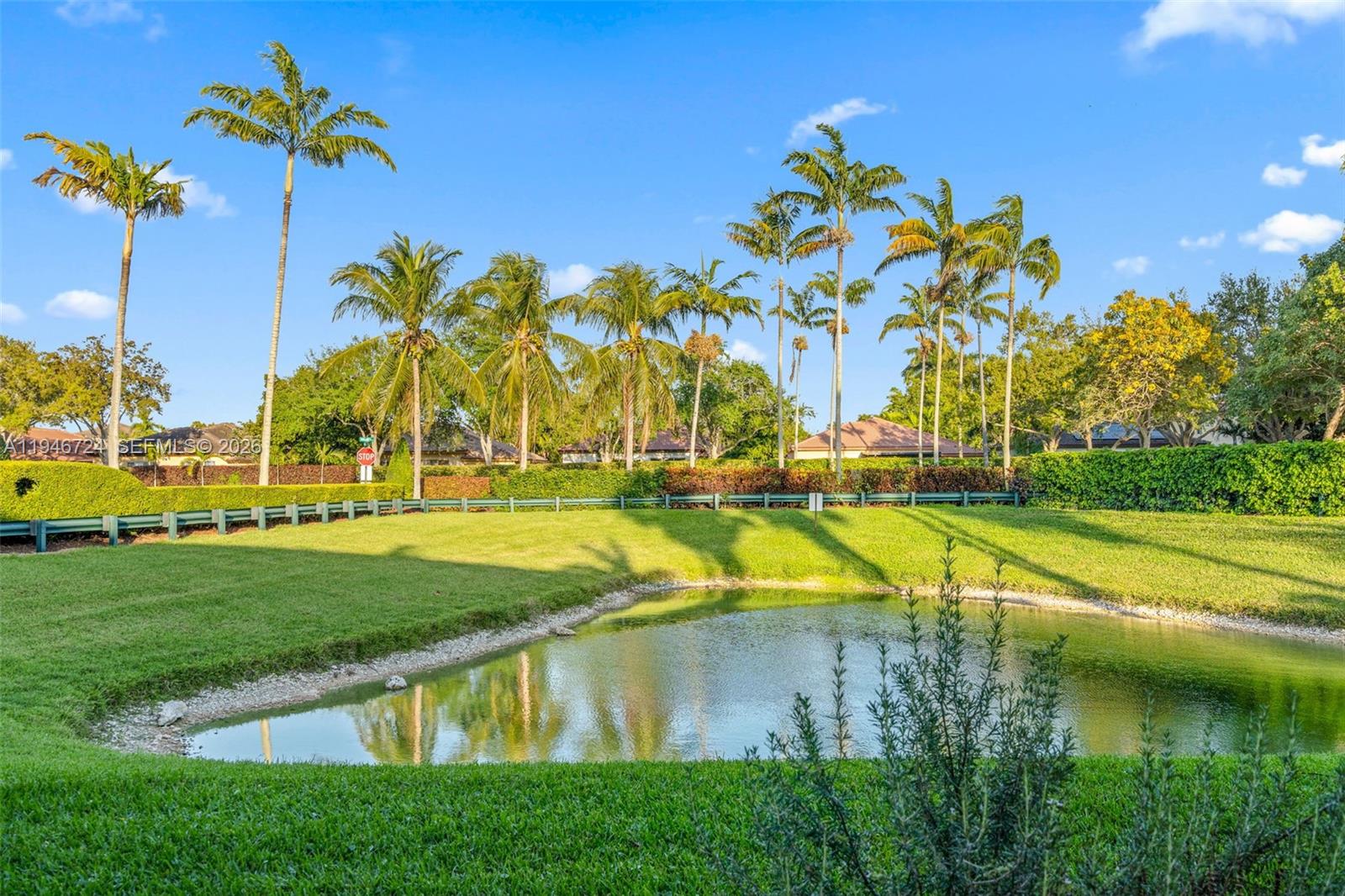 945 Northeast 34th Avenue, Unit 103 Homestead, FL 33033 - Photo 5 of 40 Close-up of pond from back patio and quick access
