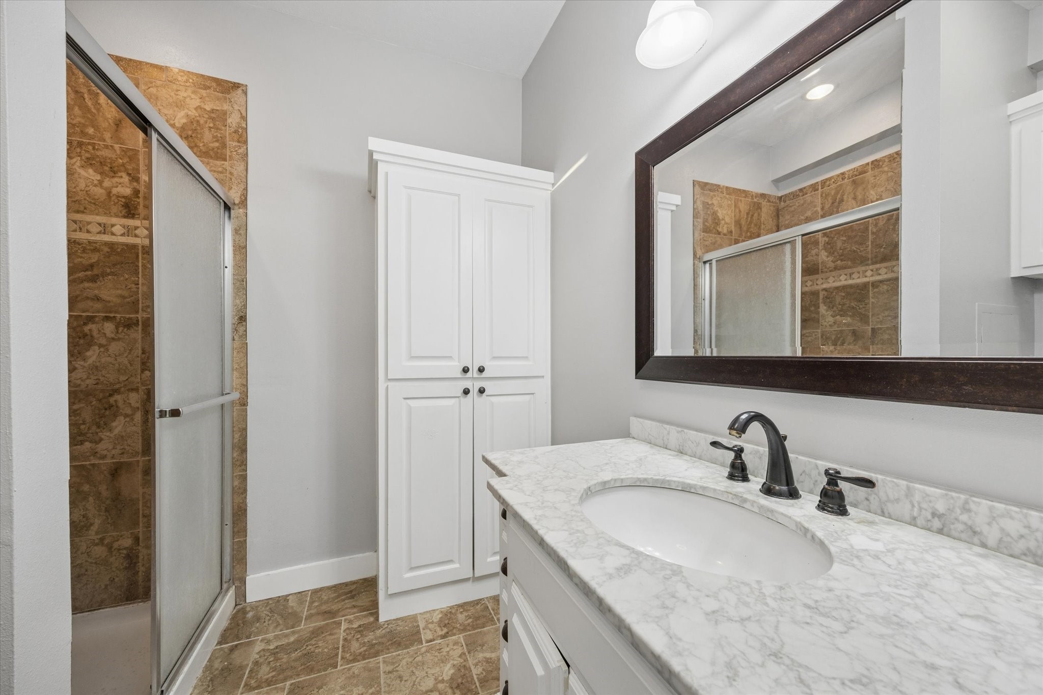 10347 Pless Road Cat Spring, TX 78933 - Photo 16 of 41 Master bathroom with a large vanity and walk in shower.