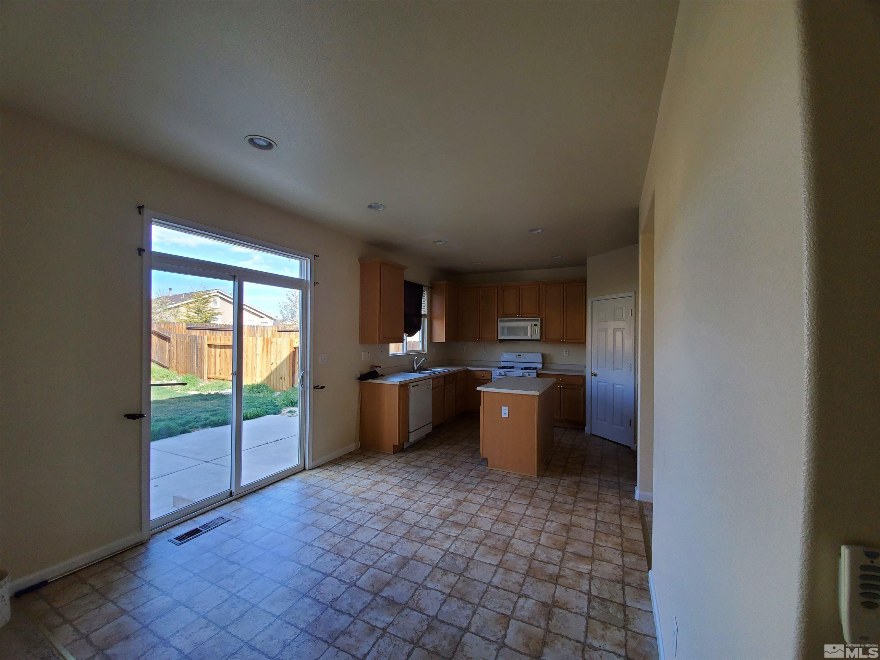 2306 Clementine Lane Reno, NV 89521 - Photo 14 of 16 a view of a kitchen with furniture and window