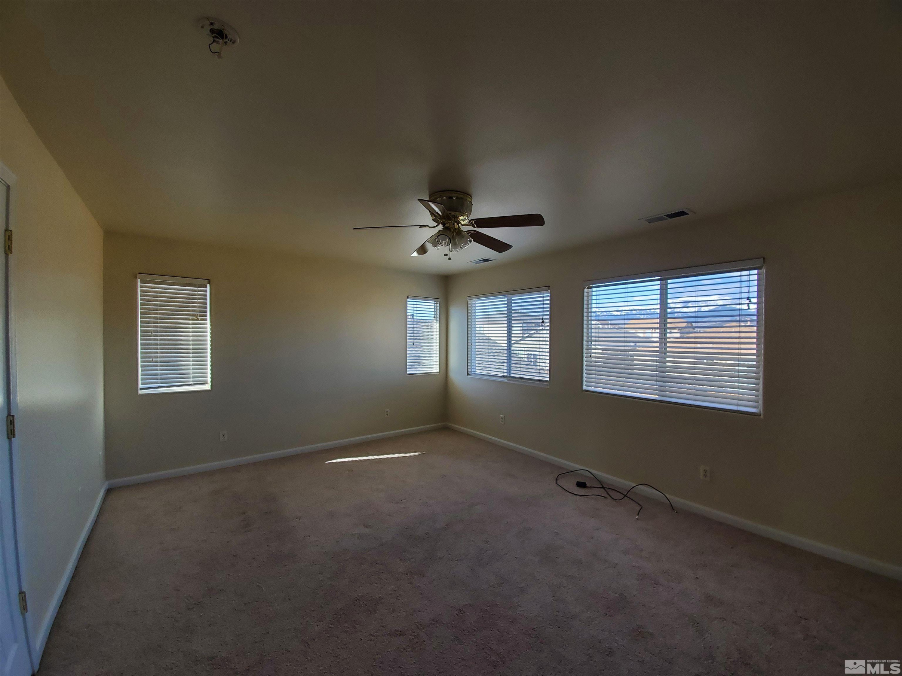 2306 Clementine Lane Reno, NV 89521 - Photo 5 of 16 a view of an empty room with a window