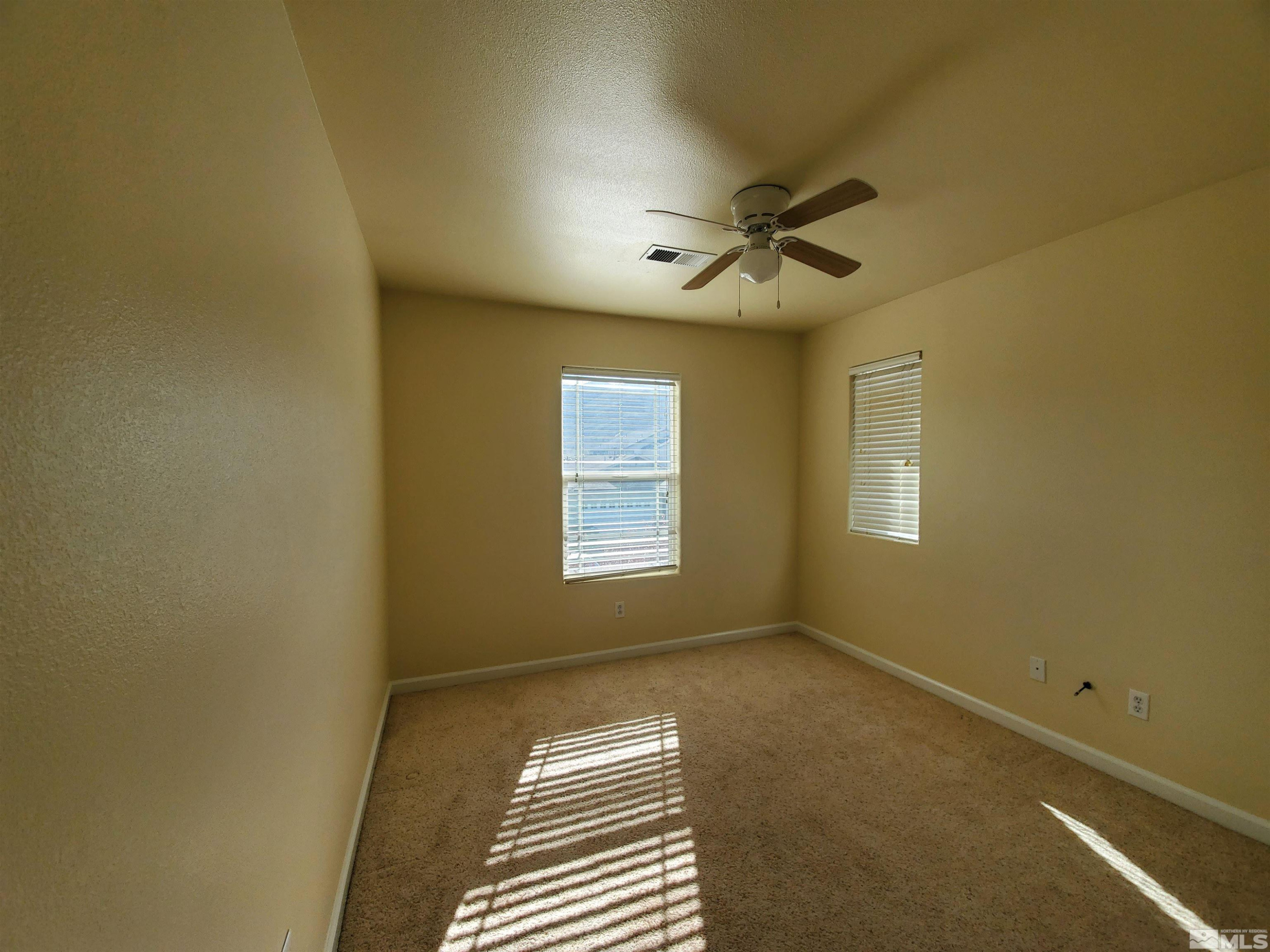 2306 Clementine Lane Reno, NV 89521 - Photo 7 of 16 a view of an empty room with a window