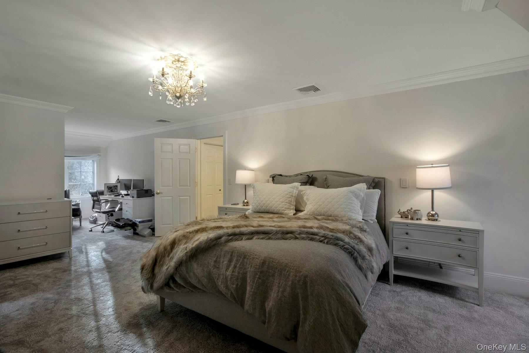 129 Washington Spring Road Palisades, NY 10964 - Photo 28 of 44 Bedroom with crown molding, a notable chandelier, and dark colored carpet