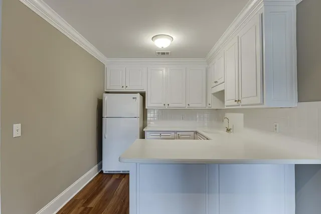 a bathroom with a sink a light fixture and a mirror