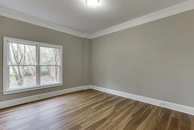 a view of balcony with wooden floor