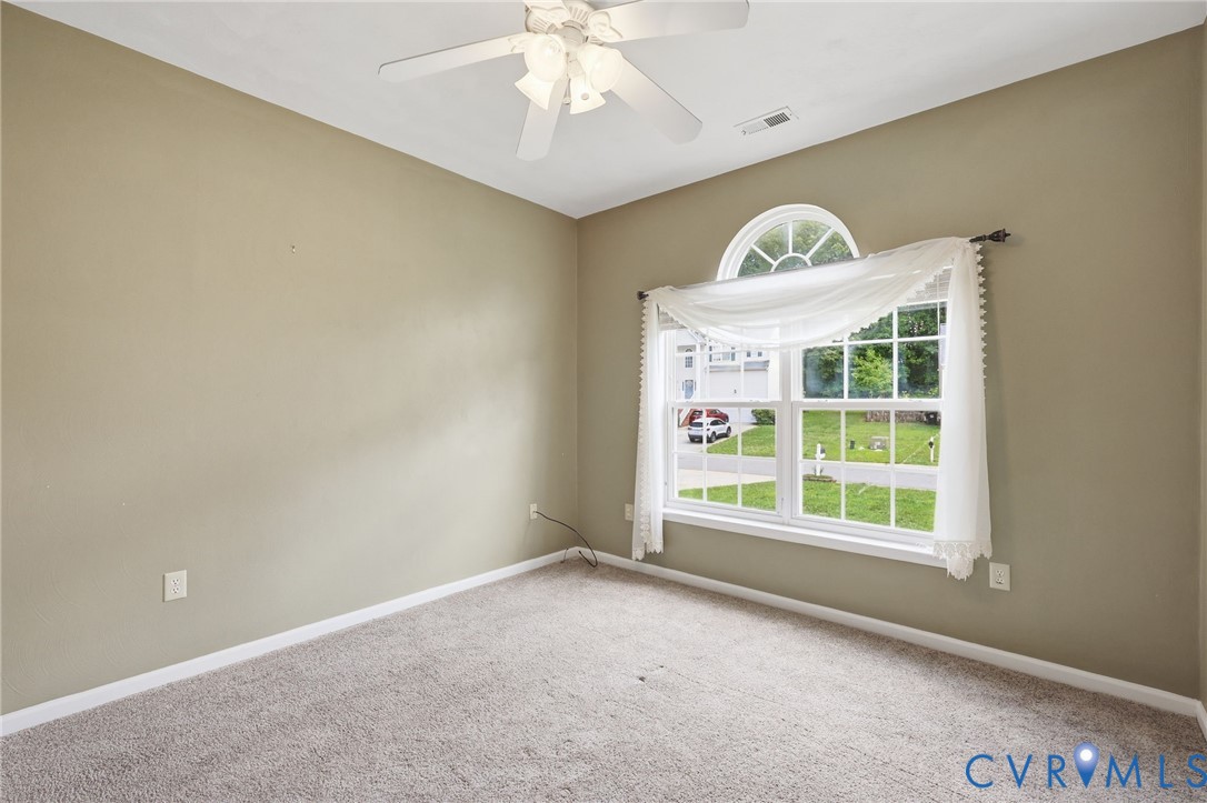 14719 Clover Ridge Lane Chesterfield, VA 23832 - Photo 22 of 36 Carpeted room featuring a large window with an arc