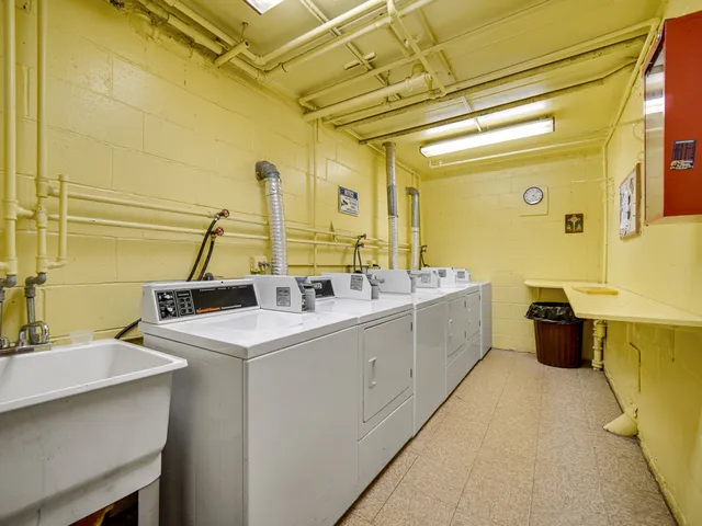 a bathroom with a double vanity sink and mirror