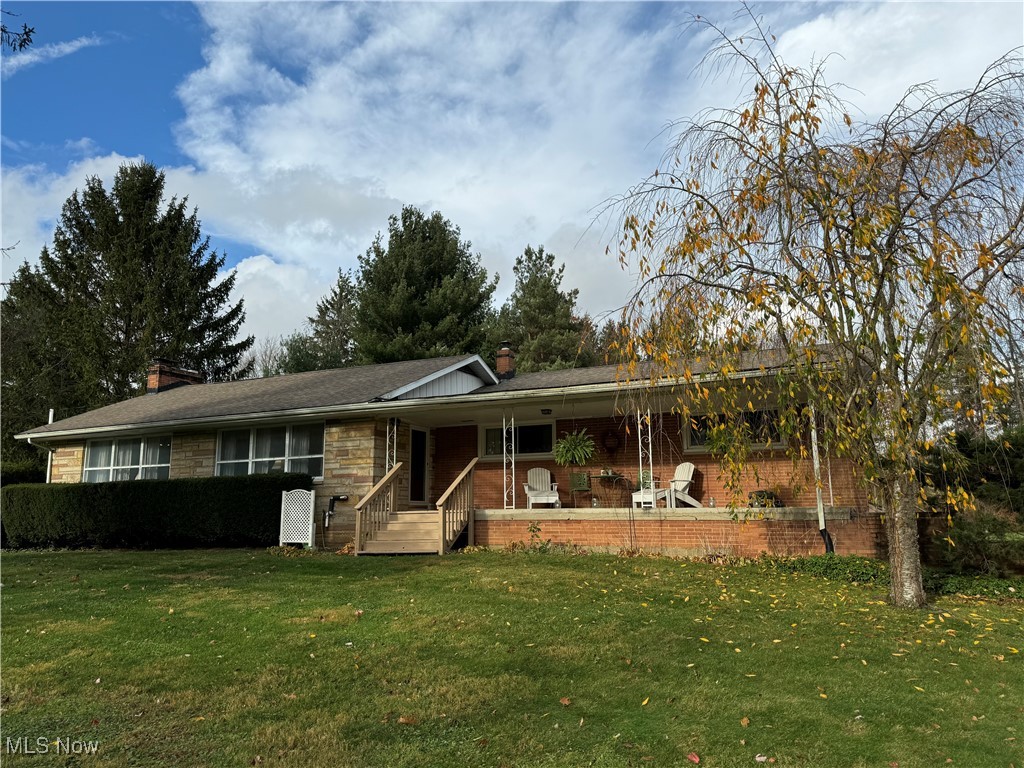 View of front of house featuring a roomy front porch.