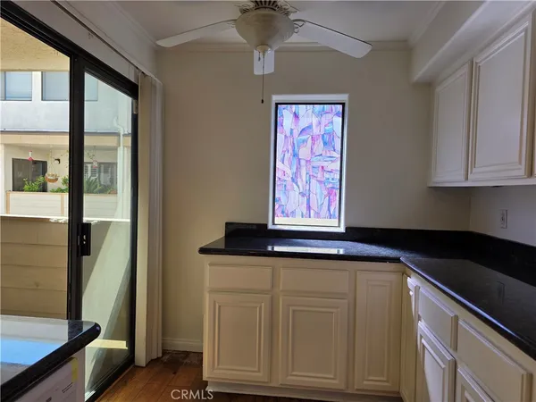 a kitchen with sink and cabinets