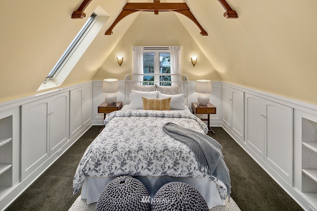 537 Northeast 82nd Street Seattle, WA 98115 - Photo 13 of 28 a bedroom with a large bed and a window
