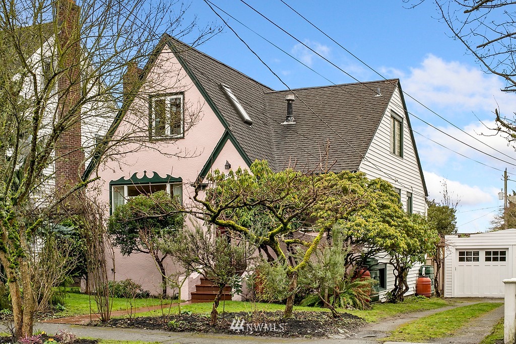 537 Northeast 82nd Street Seattle, WA 98115 - Photo 24 of 28 a view of a white house with a yard