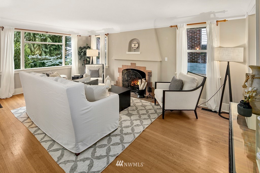 537 Northeast 82nd Street Seattle, WA 98115 - Photo 3 of 28 a living room with furniture a large window and a fireplace