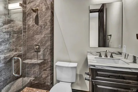 a view of a kitchen with a stove top oven