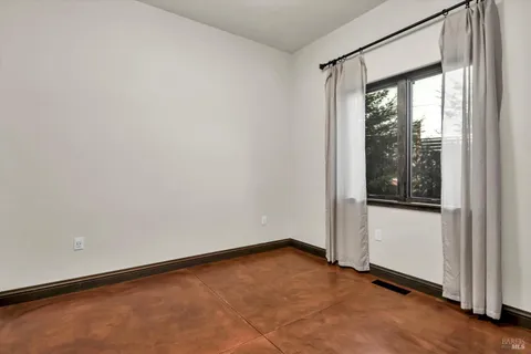 a view of a chairs and table in patio