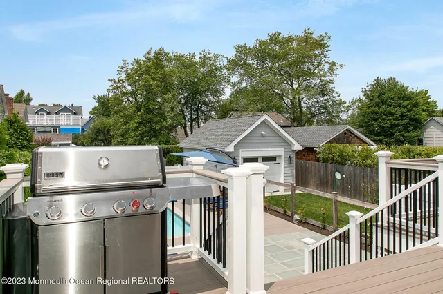 a front view of a house with iron fence