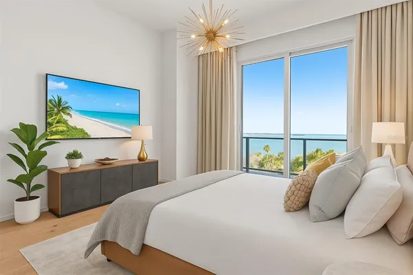 a bedroom with a bed and a potted plant