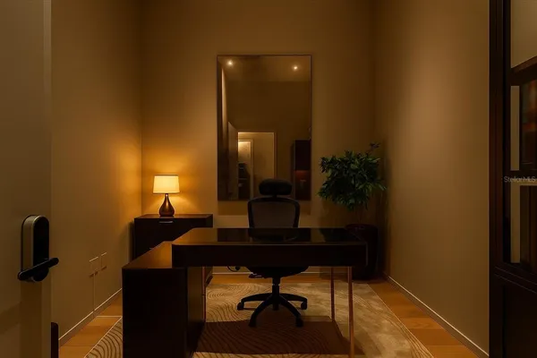 a living room with furniture and a potted plant