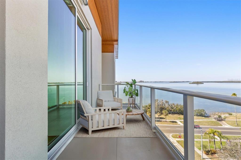 1020 Sunset Point Road, Unit 703 Clearwater, FL 33755 - Photo 21 of 50 a balcony view with a couch