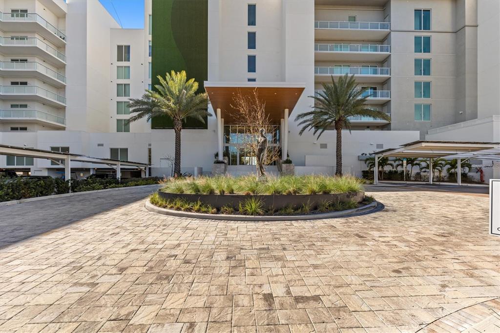 1020 Sunset Point Road, Unit 703 Clearwater, FL 33755 - Photo 27 of 50 a view of a building with potted plants