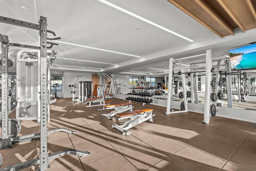 1020 Sunset Point Road, Unit 703 Clearwater, FL 33755 - Photo 43 of 50 a view of a room with gym equipment